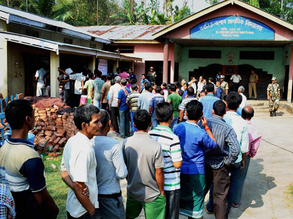 Voters waiting in a queue to cast their vote