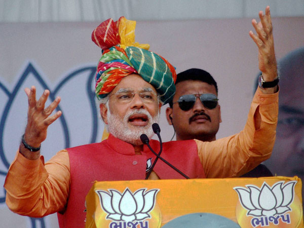 Narendra Modi addresses an election campaign rally in Anand