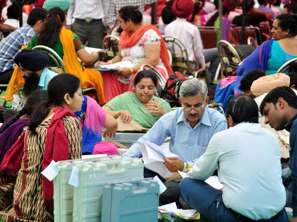Polling officials check election material