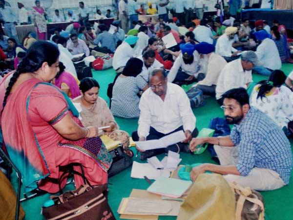 Polling officials check election material