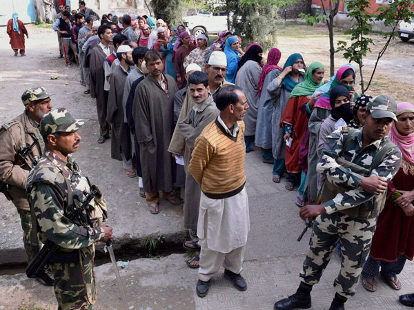 People wait to cast their vote for Srinagar Lok Sabha contituency