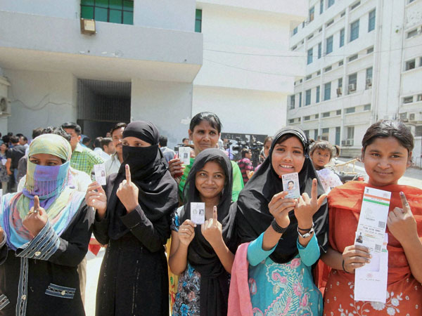 Young voters show their identity cards