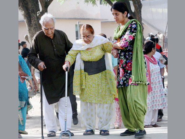 An elderly couple after casting votes for Lok Sabha polls