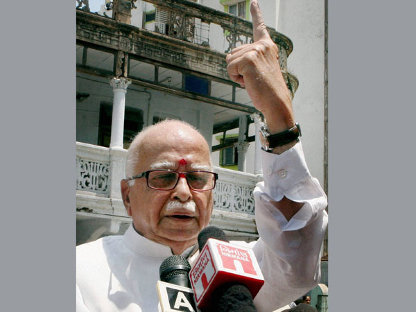 L K Advani addresses the media after casting his vote