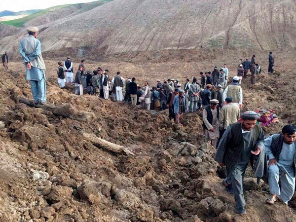 Afghans search for survivors after a massive landslide 