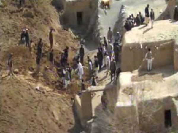 Afghans search for survivors after a massive landslide