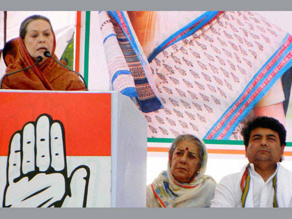 Sonia Gandhi addresses an election campaign at Padrauna