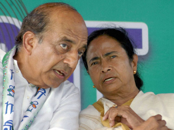 Mamata Banerjee with party candidate Dinesh Trivedi during an election campaign 