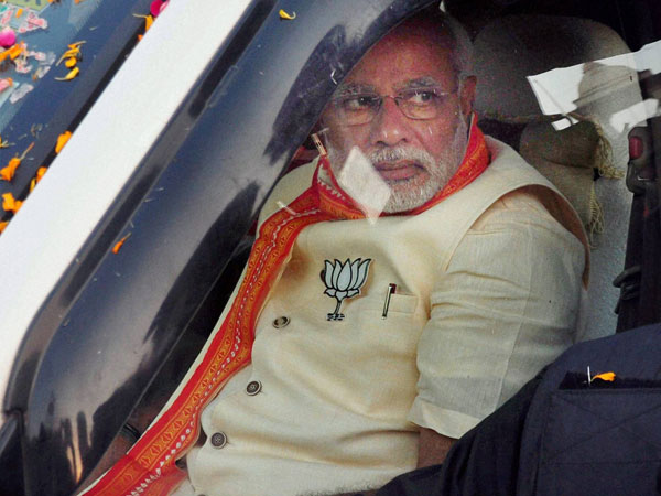 Narendra Modi during an election road show in Varanasi 