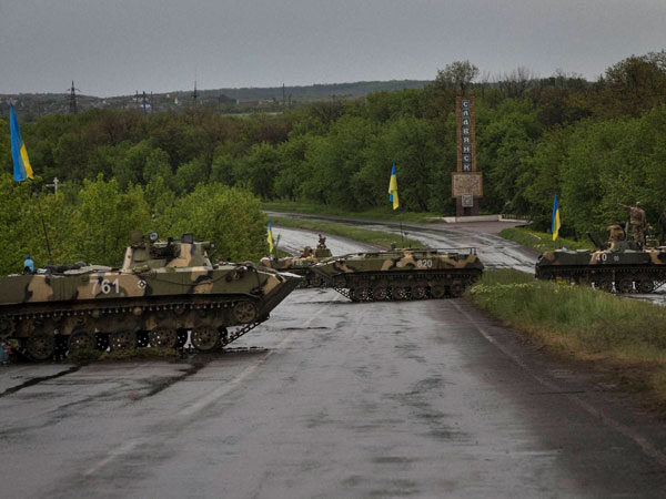 Armored vehicles man checkpoints in Ukraine 