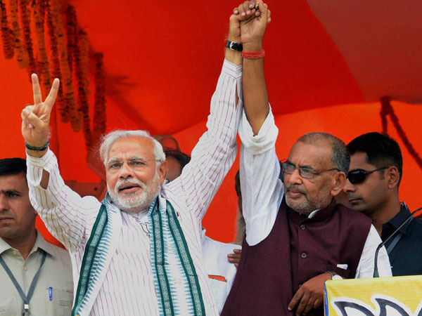 Narendra Modi flashes victory sign