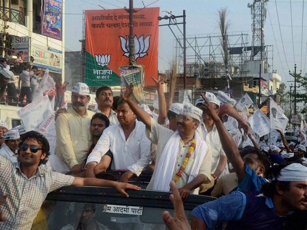 Arvind Kejriwal waves at supporters