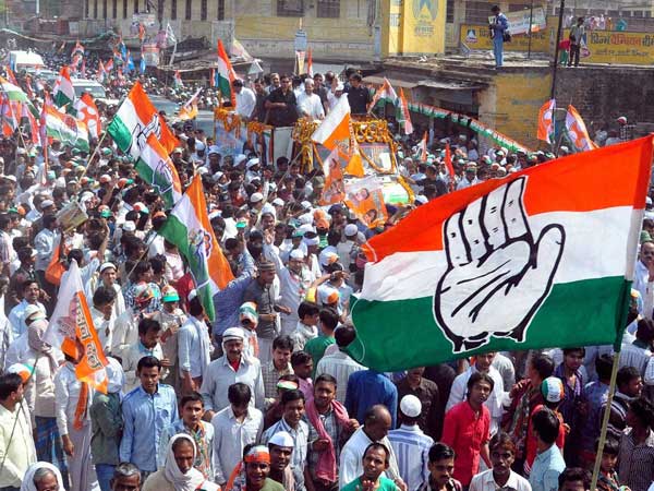 Rahul Gandhi with party candidate Ajay Rai during an election road show