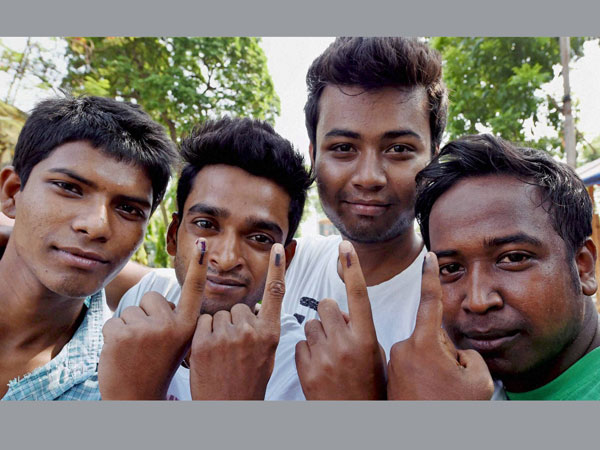 First time voters showing the ink marks after casting their votes
