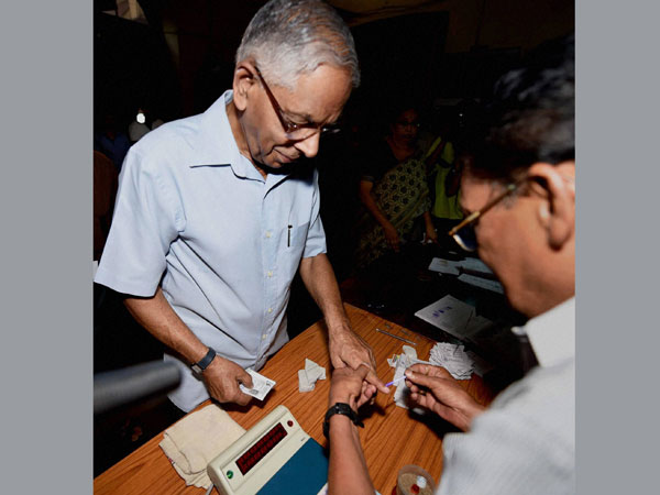 West Bengal Governor M K Narayanan gets his finger inked