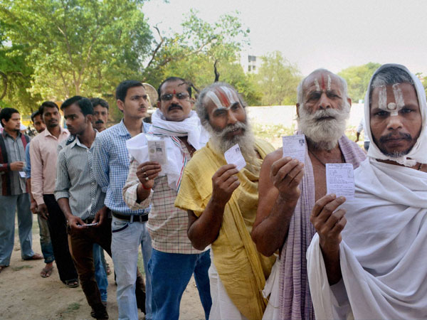 Sadhus wait to cast their votes