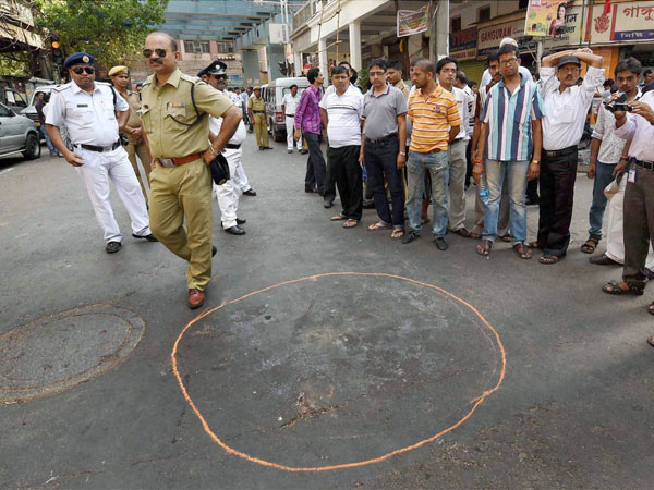 Police personnel and public near the spot