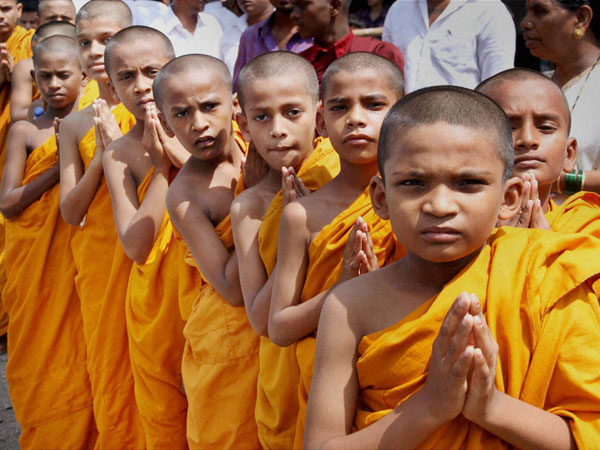 Children dressed as Buddhist monks celebrating Buddha Purnima
