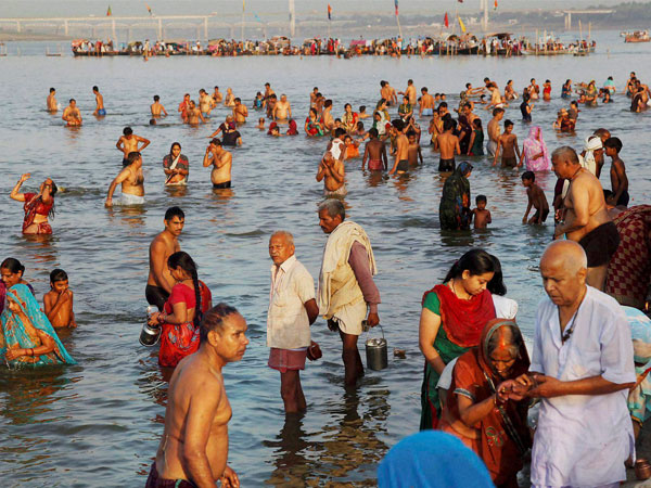 Hindu devotees taking holy dip at Sangam