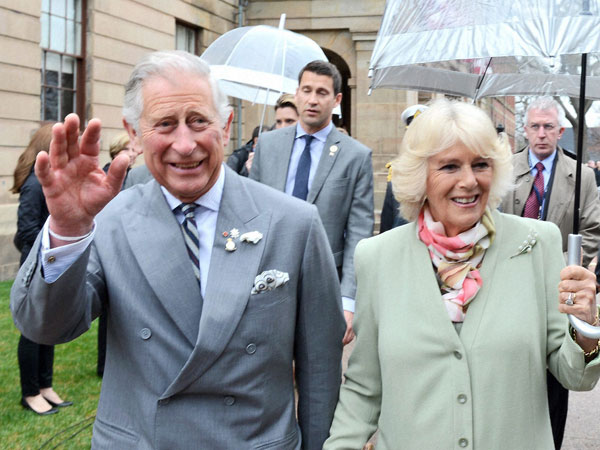 Prince Charles and his wife Camilla waves to supporters