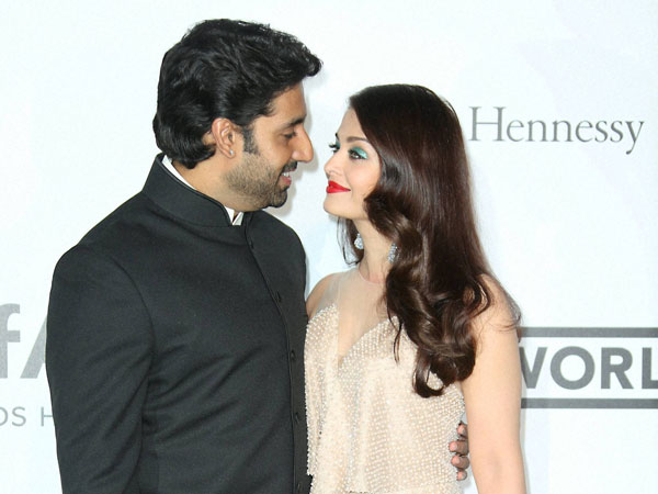 Abhishek Bachchan and Aishwarya Rai Bachchan arrive at the amfAR Cinema