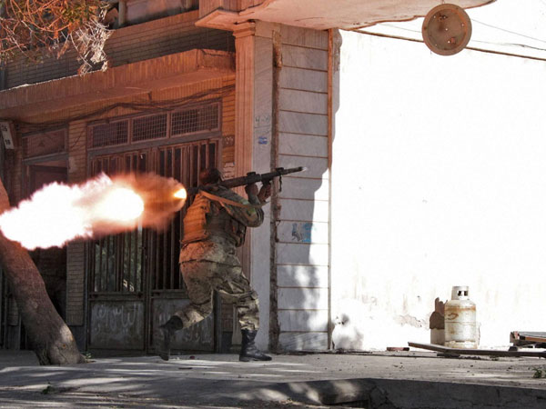 An Afghanistan National Army (ANA) soldier fires his weapon