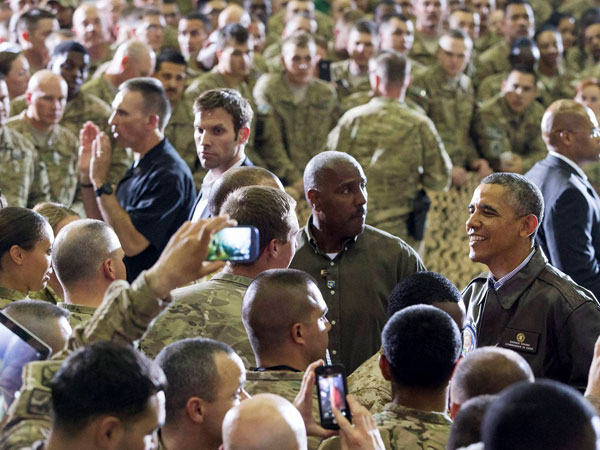 Barack Obama is all smiles for the camera