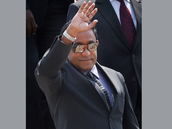 Maldives President Abdulla Yameen waves upon his arrival 