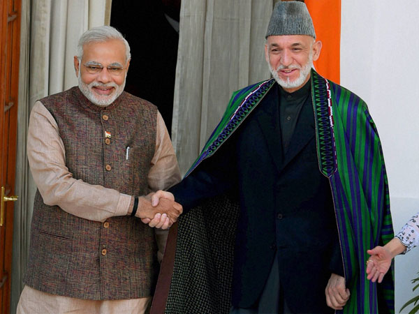 Prime Minister Narendra Modi shakes hand with Afghan President Hamid Karzai