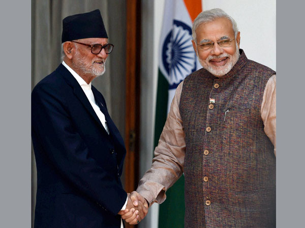 Prime Minister Narendra Modi shakes hands with his Nepali Counterpart Sushil Koirala