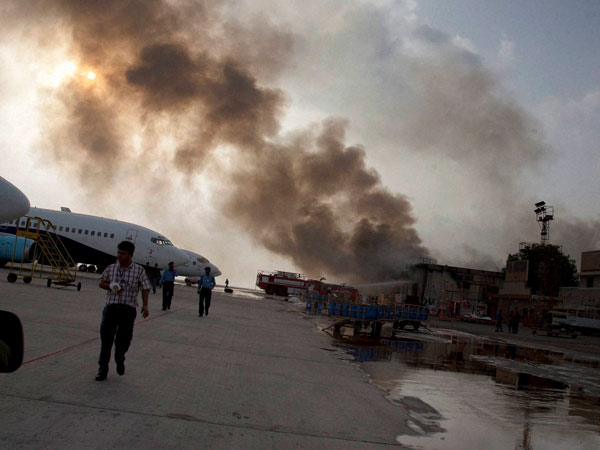 Smoke rises above the Jinnah International Airport 