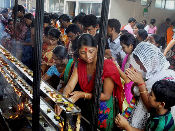 Devotees light incense sticks and earthen lamps at Kamakhya Temple 
