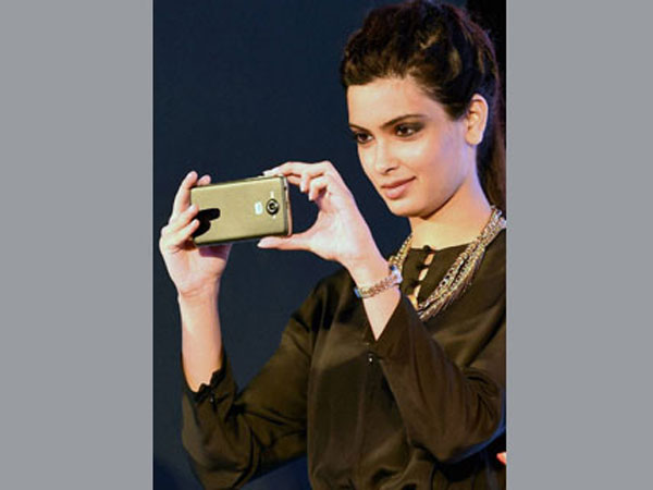 Diana Penty clicking pictures from the Micromax Canvas 