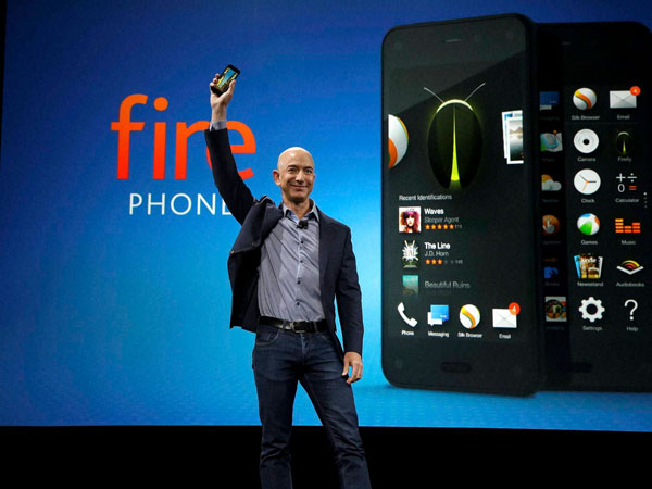 Amazon CEO Jeff Bezos holds up the new Amazon Fire Phone