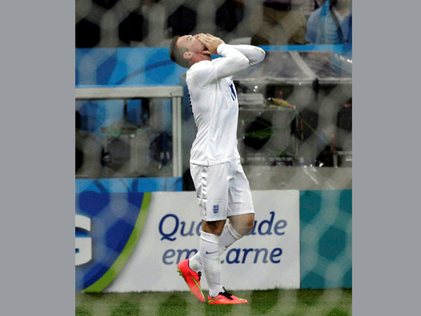 England's Wayne Rooney celebrates after scoring his side's first goal 