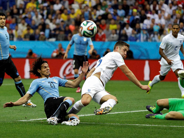 England's Gary Cahill kicks the ball away on an attack