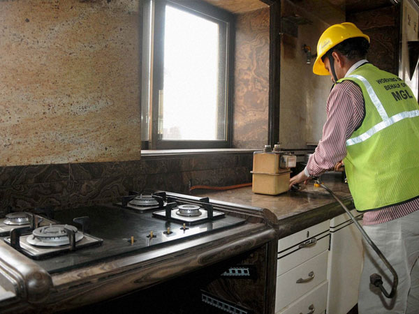 A BMC employee disconnects the gas supply to the Campa Cola Society
