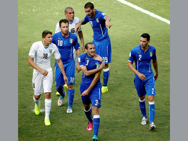 Italy's Giorgio Chiellini (3) displays his shoulder