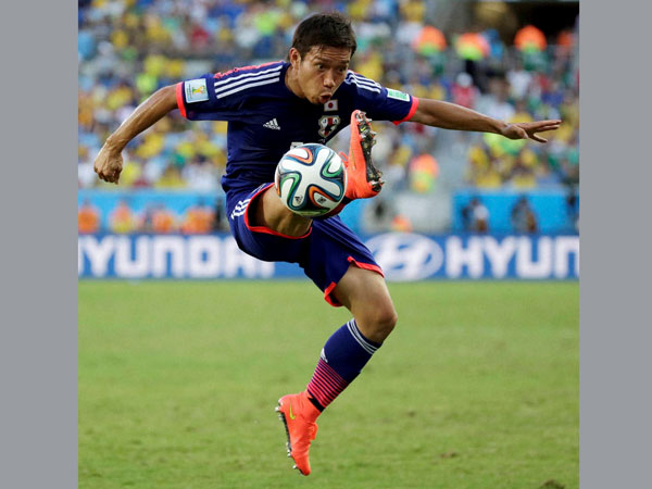 Japan's Yuto Nagatomo controls the ball