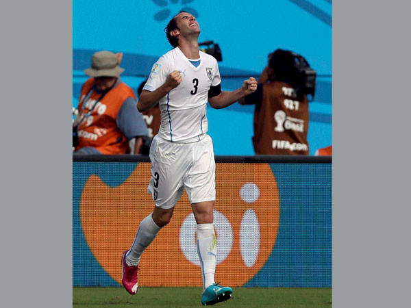 Uruguay's Diego Godin celebrates scoring the opening goal 