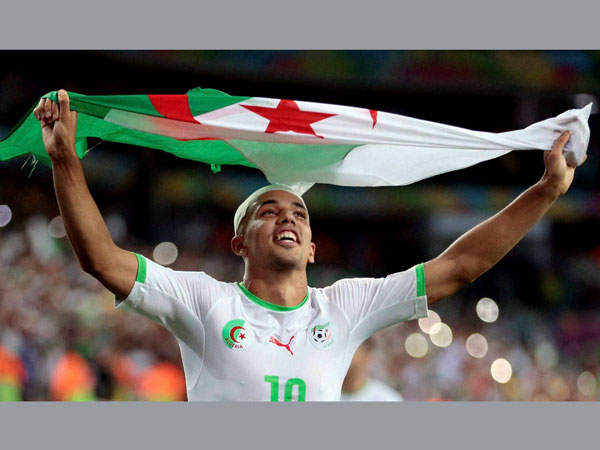 Algeria celebrates after qualifying for round of 16 