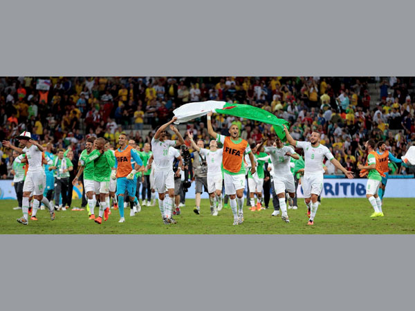 Algerian players celebrate after the group H World Cup soccer 