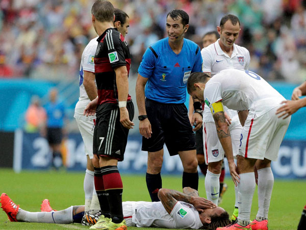 United States' Kyle Beckerman lies on the pitch 