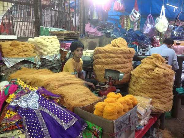 A young boy sells sweets on the eve of Ramzan