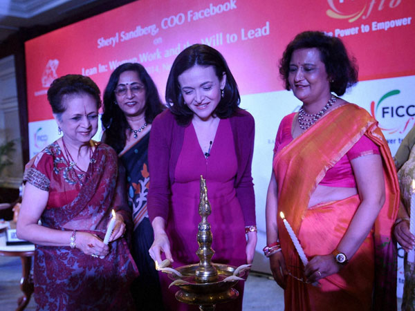 Facebook CEO Sheryl Sandberg lighting the lamp 