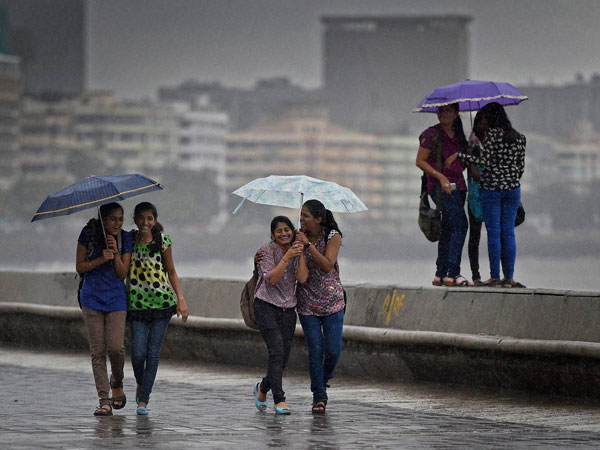 College girls enjoy the rains in Mumbai