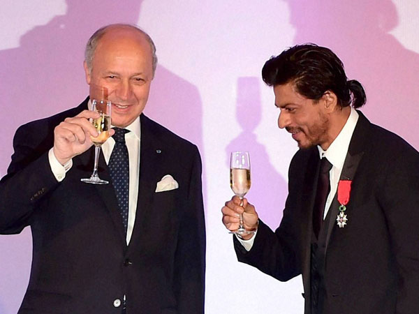 Bollywood superstar Shah Rukh Khan raises his glass