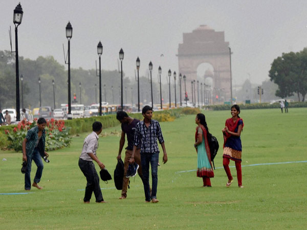 Youngsters enjoy the rains at an India Gate lawn