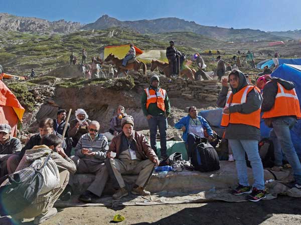 Pilgrims rest on their way to Amarnath Holy Cave Shrine