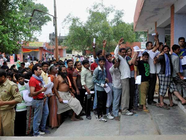 Pilgrims standing in queues to register for the annual pilgrimage